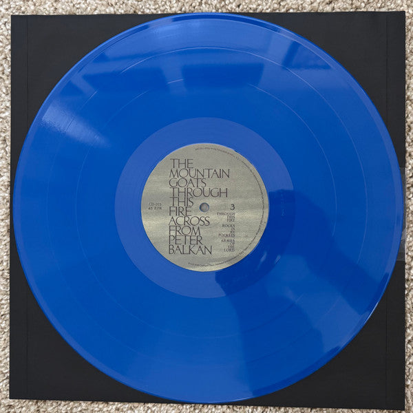 The Mountain Goats : Through This Fire Across From Peter Balkan (2xLP, Album, Ltd, Blu)