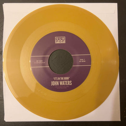 John Waters : It's In The Book (7", Single, Gol)