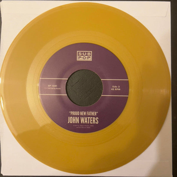 John Waters : It's In The Book (7", Single, Gol)