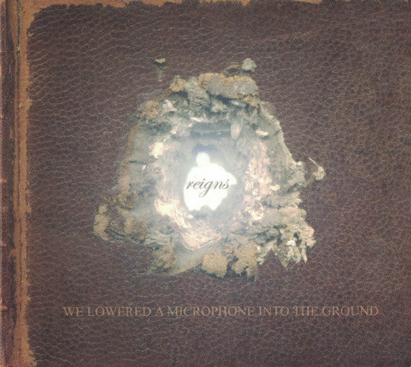 Reigns : We Lowered A Microphone Into The Ground (CD, Album)